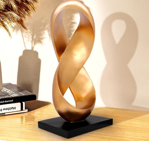 Scultura astratta dorata in resina 38 cm