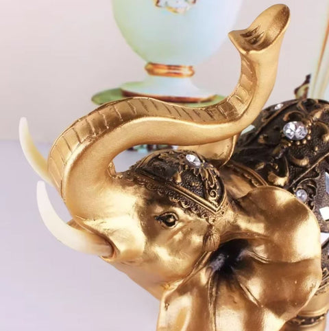 Statua elefante in resina dorata 15 cm