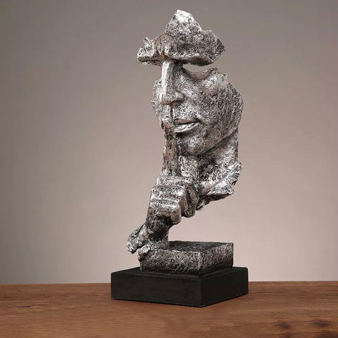 Statua del volto dell'uomo<br> Il silenzio è d'oro