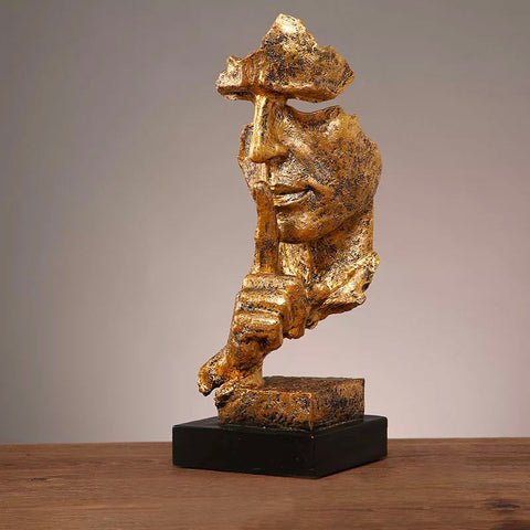 Statua del volto dell'uomo<br> Il silenzio è d'oro