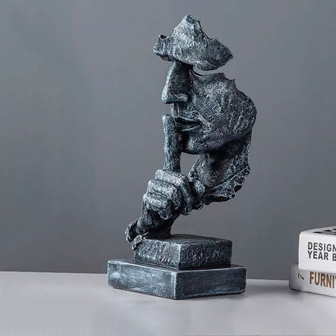 Statua del volto dell'uomo<br> Il silenzio è d'oro