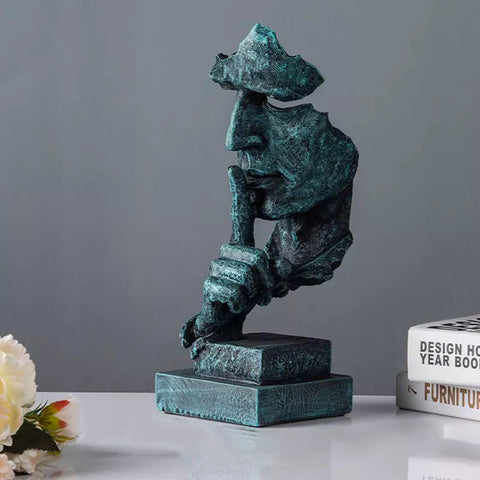 Statua del volto dell'uomo<br> Il silenzio è d'oro