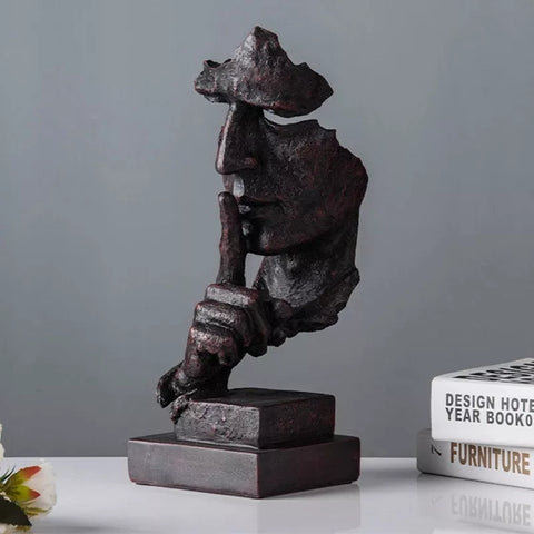 Statua del volto dell'uomo<br> Il silenzio è d'oro